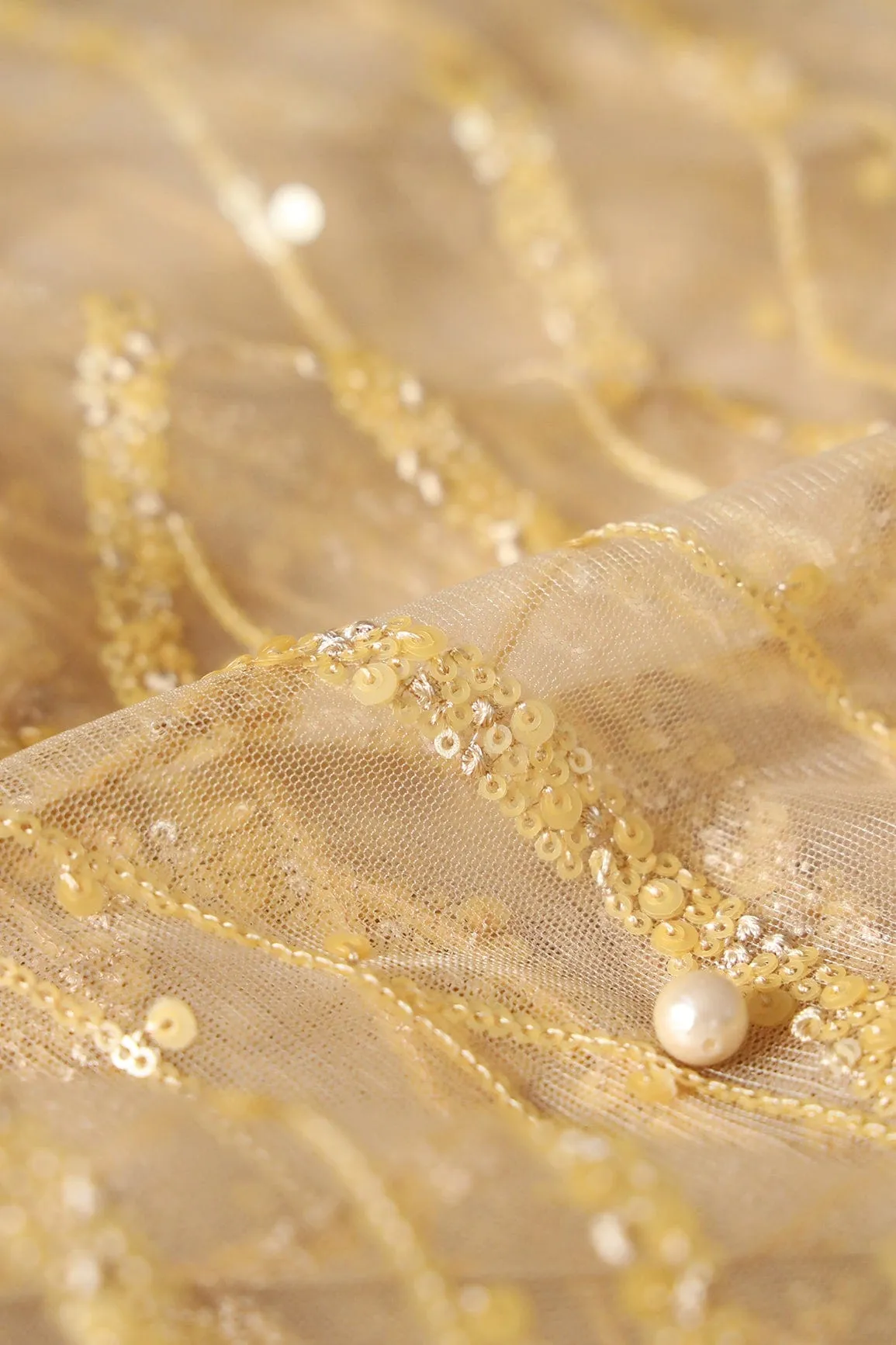 Beautiful Sequins With Beige Thread Wavy Embroidery Work On Beige Soft Net Fabric